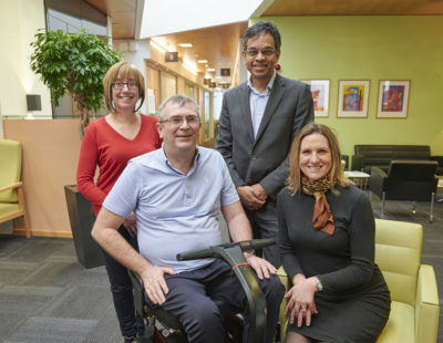 First trial participant Alan Gray with his wife Beverley alongside, Director of the MND-SMART Clinical Trial, Professor Siddharthan Chandran and MND Nurse Consultant, Judy Newton.